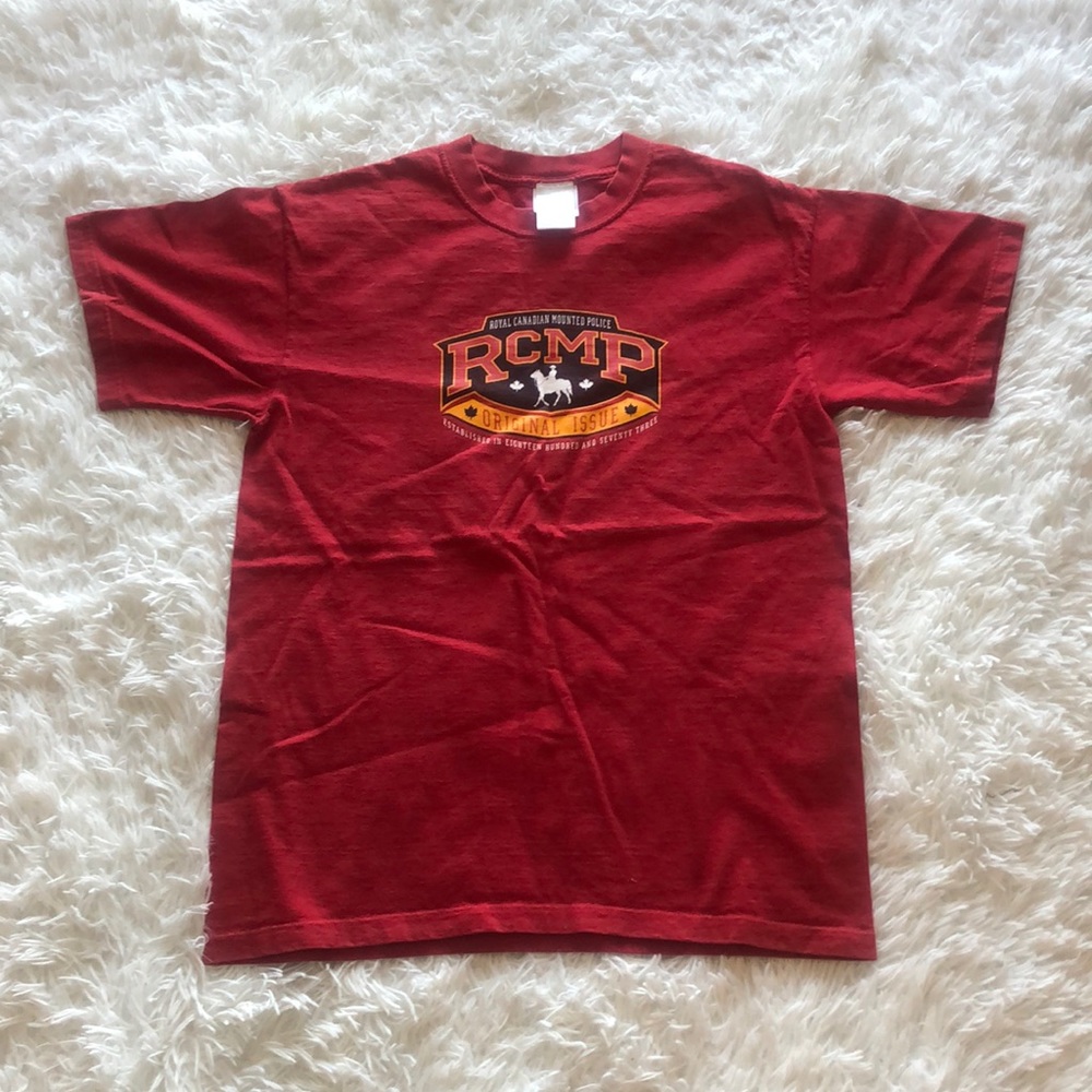 RCMP (Royal Canadian Mounted Police) shirt.